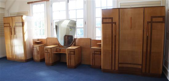 An Art Deco four piece maple and walnut bedroom suite, triple wardrobe W.5ft 6in.